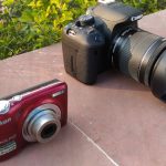 product photo of the point and shoot camera with DSLR camera on its right