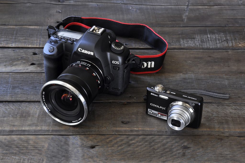product photos of DSLR camera, on the left ,and the of the point and shoot camera, on the right