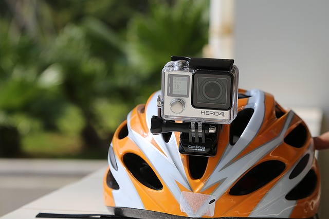gopro attached to the gopro helmet mount on top of the head of a helmet